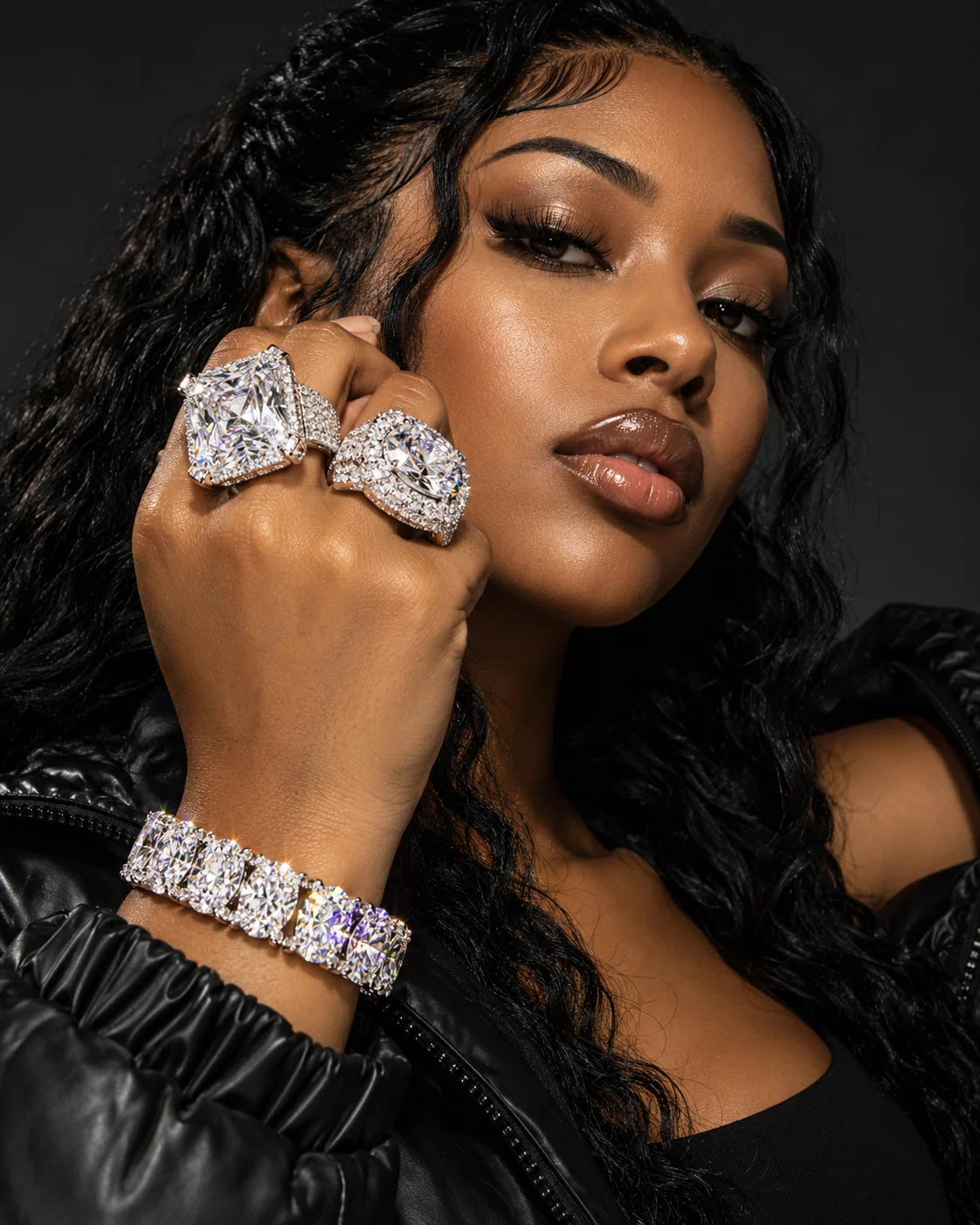 Hip-hop model wearing oversized diamond rings and an iced bracelet